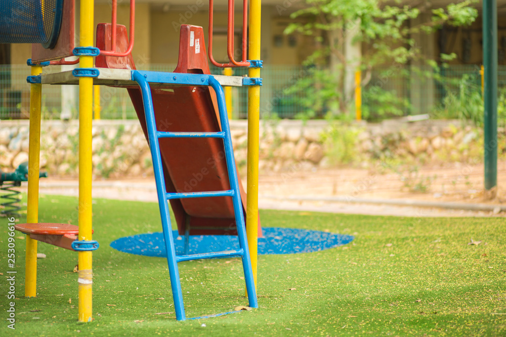 Children  slide stair on playground.