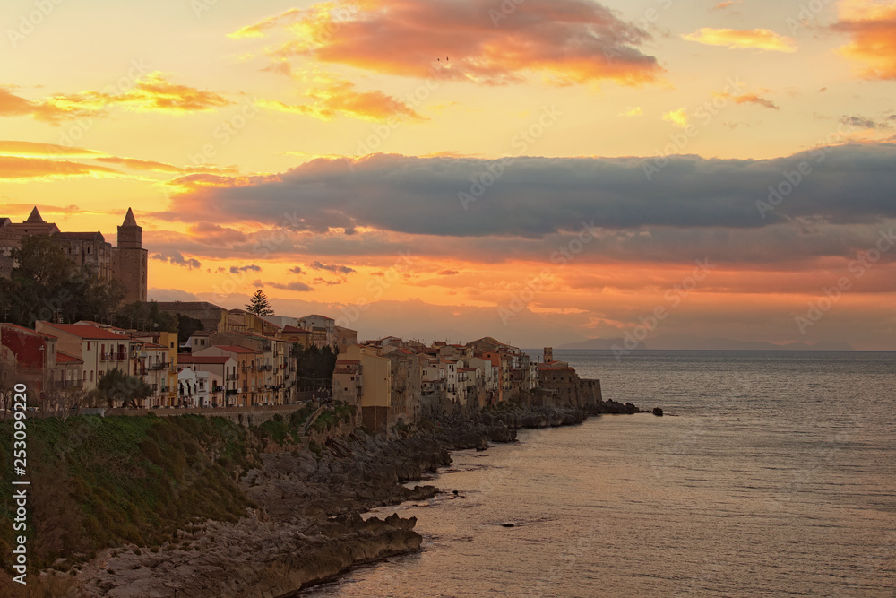 Beautiful landscape photo of coastal town Cefalu. Panoramic dramatic sunset sky. Famous touristic places and romantic travel destinations in Italy. Cefalu, Sicily