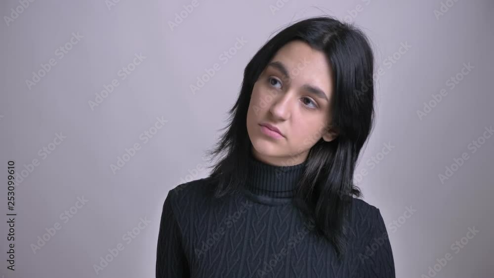 Closeup shoot of young attractive caucasian female being sad and disappointed in front of the camera Closeup shoot of young attractive caucasian female being sad and disappointed in front of the camera