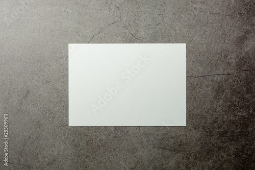 blank white paper on cement floor. - for message and advertising background.