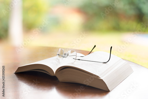 Reading glasses on top of a book