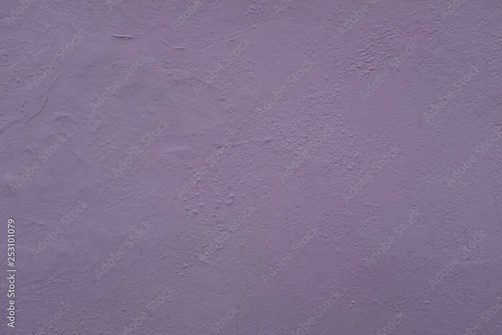 A close up photo of an exterior wall painted purple textured, surface with stucco daub, great for background A close up photo of an exterior wall painted purple textured, surface with stucco daub, great for background