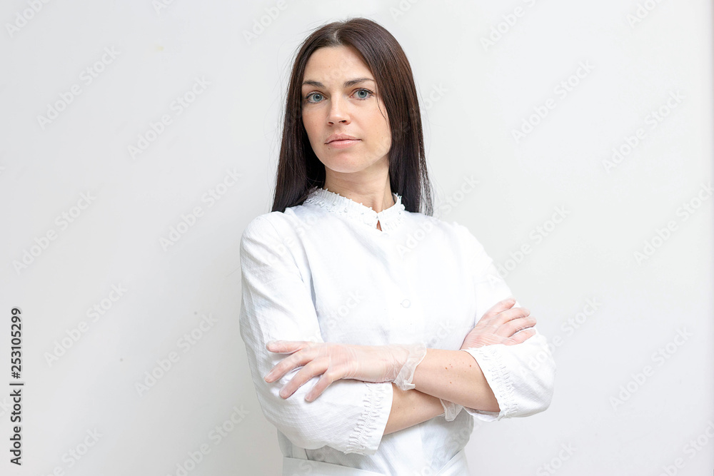 A portrait of a woman cosmetologist in a spa center A portrait of a woman cosmetologist in a spa center