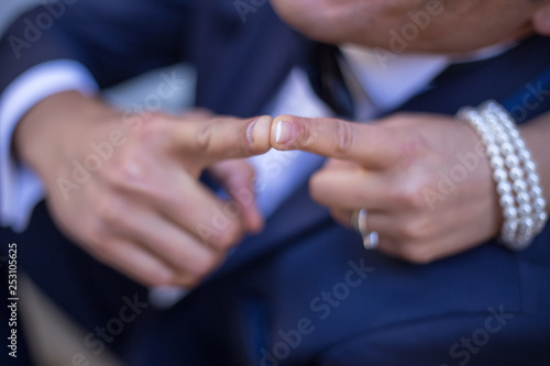 road of love and happiness  hands of a newly wed couple together 