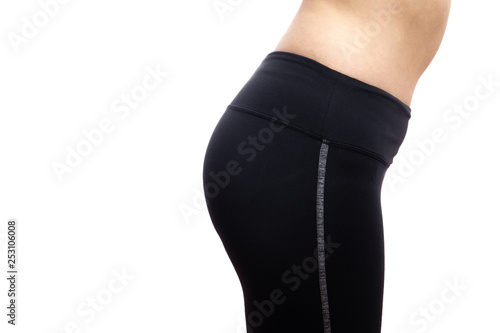 Lower body of fat women in sport wear close up. Isolated on white background.