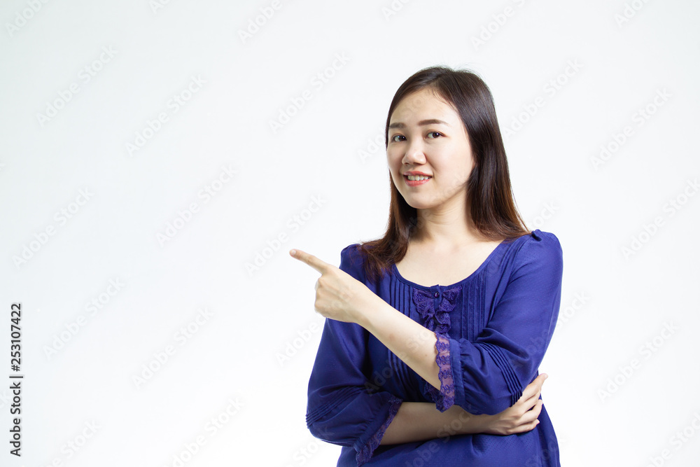 Pretty Asian girl pointing her finger close up.
