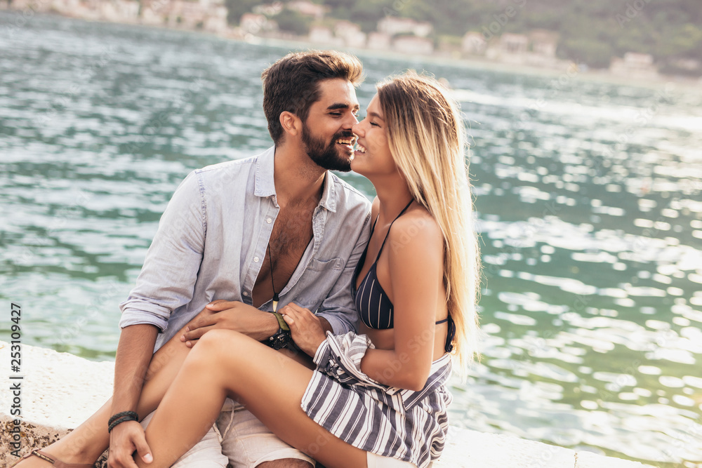 Couple in love, enjoying the summer time by the sea. Couple in love, enjoying the summer time by the sea.
