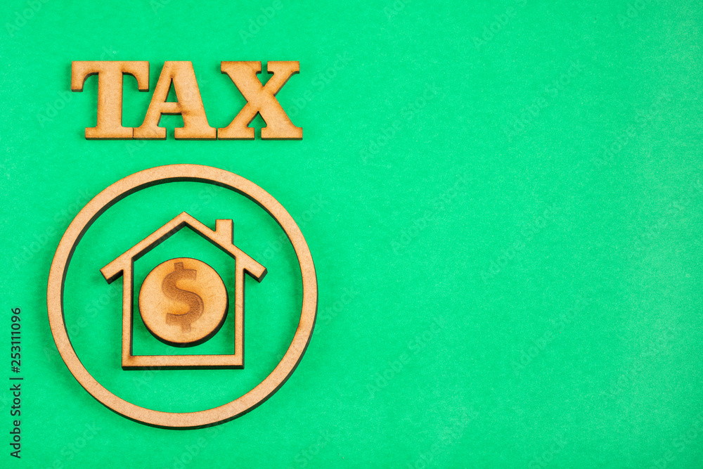 Housing tax concept - Green background. Text space
