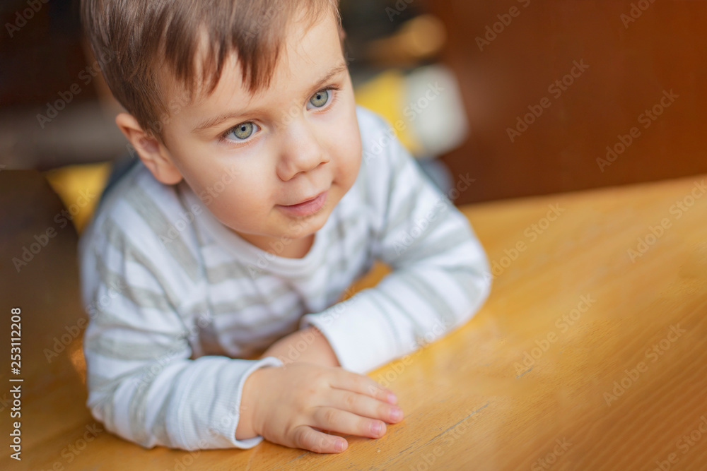 A little boy clapping his mother or his father in a palm, a photo from the first person. The boy gives his hand five to the friends opposite. Give me five A little boy clapping his mother or his father in a palm, a photo from the first person. The boy gives his hand five to the friends opposite. Give me five