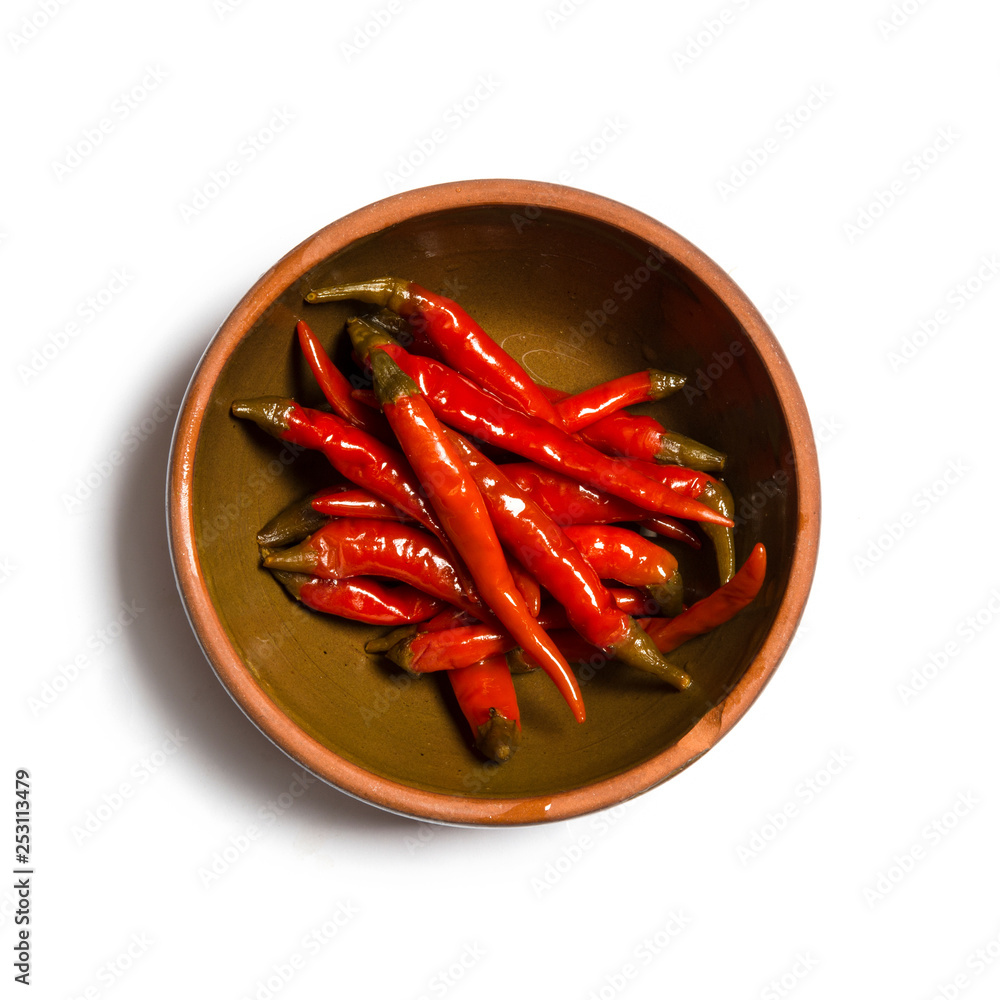 pickled red pepper on plate isolated on white background pickled red pepper on plate isolated on white background