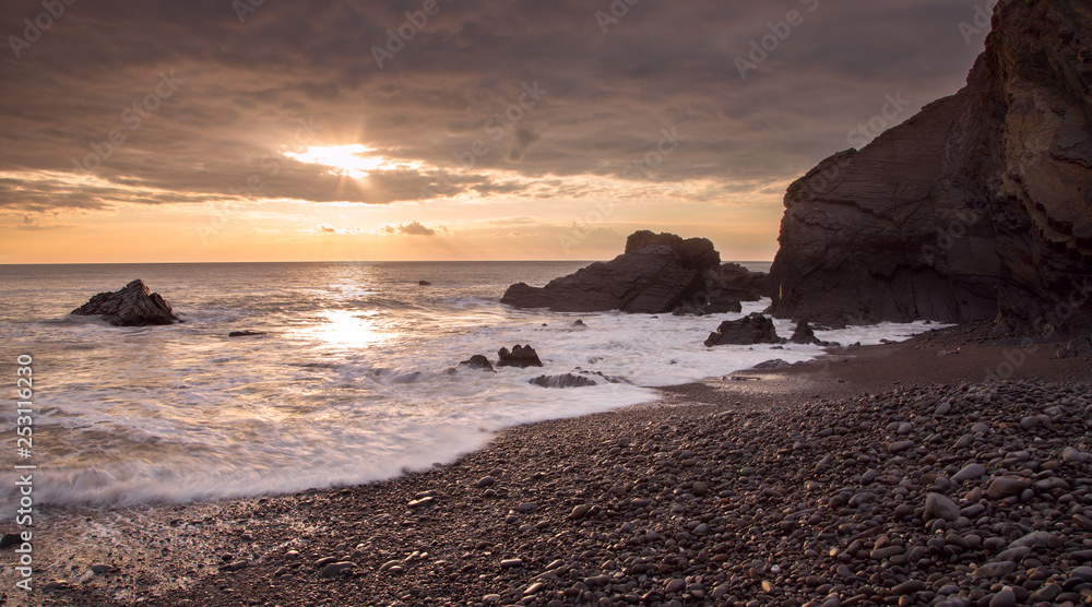 Sunset Sandymouth beach Cornwall Uk