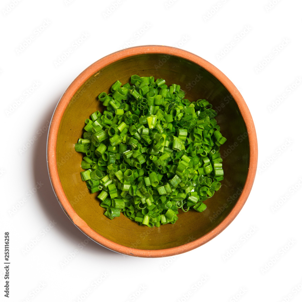 Chopped chive in a bowl isolated on white background Chopped chive in a bowl isolated on white background