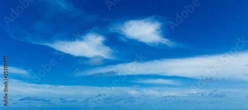 blue sky background with tiny clouds