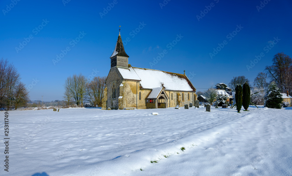 Snowy view of the chapel of St Peter ad Vincula, Colemore, South Downs National Park, Hampshire, UK