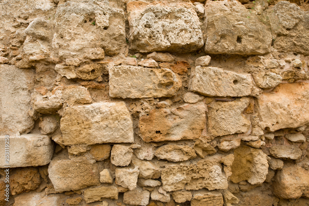 Fototapeta premium Old stone wall made of sandstone