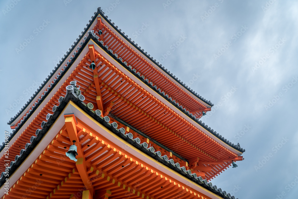 Traditional Orange Pagoda Buddhist Temple Roof, in Naga, Japan. Blue Sky in Background. Traditional Orange Pagoda Buddhist Temple Roof, in Naga, Japan. Blue Sky in Background.