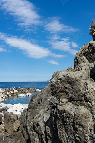 Italy,Cinque Terre,Riomaggiore, a rocky island in the middle of a large rock