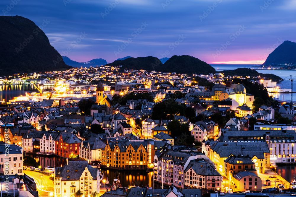 Aerial view of Alesund, Norway at sunset. Blue night sky over famous