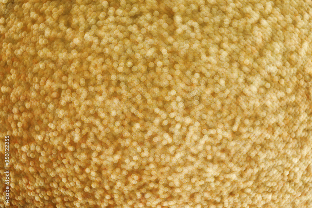 Gold glitter with bokeh effect as background, closeup Gold glitter with bokeh effect as background, closeup