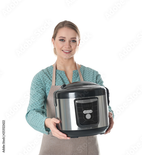 Obraz na płótnie Portrait of young woman with modern multi cooker on white background