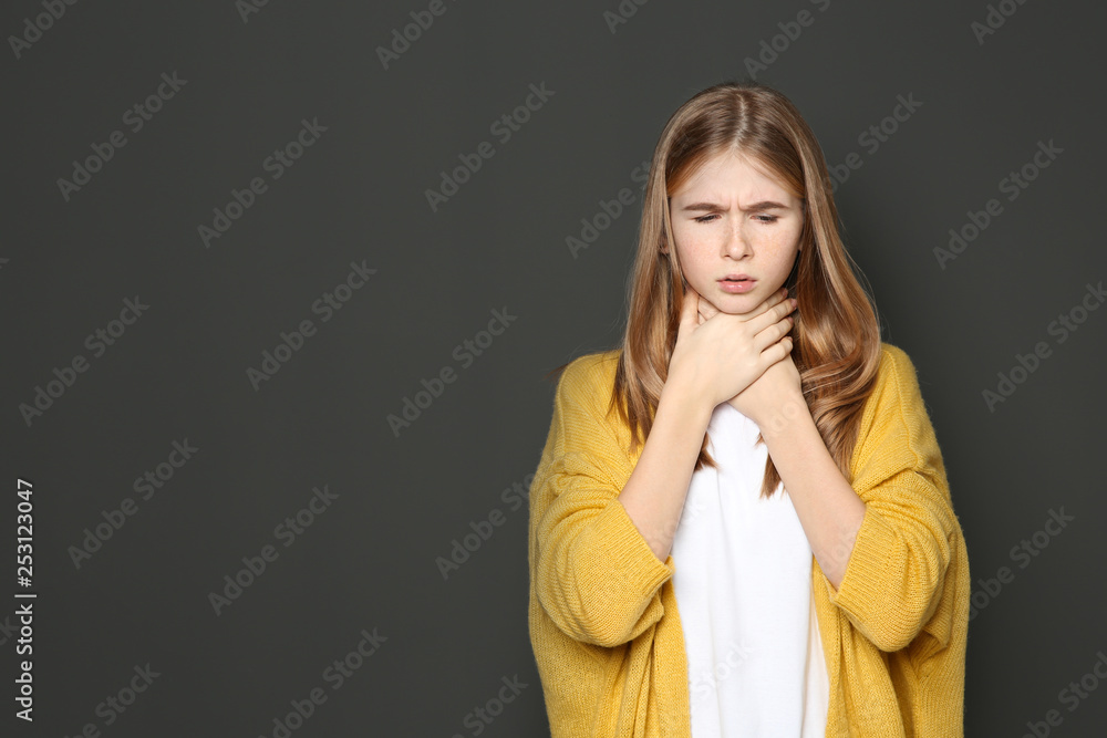 Teenage girl suffering from cough on dark background. Space for text Teenage girl suffering from cough on dark background. Space for text