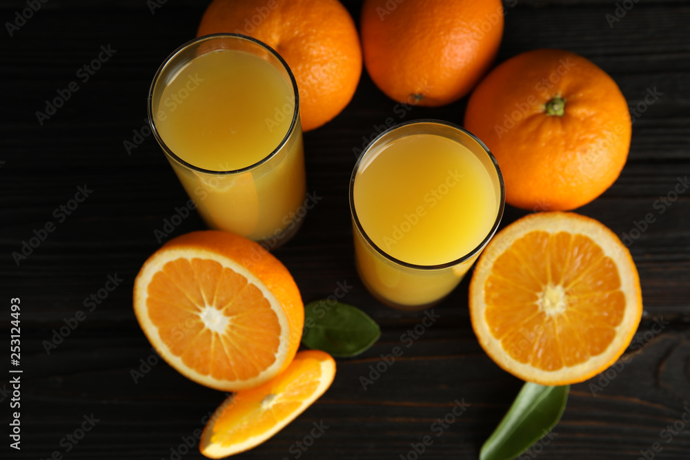 Composition with orange juice and fresh fruit on wooden background, above view Composition with orange juice and fresh fruit on wooden background, above view