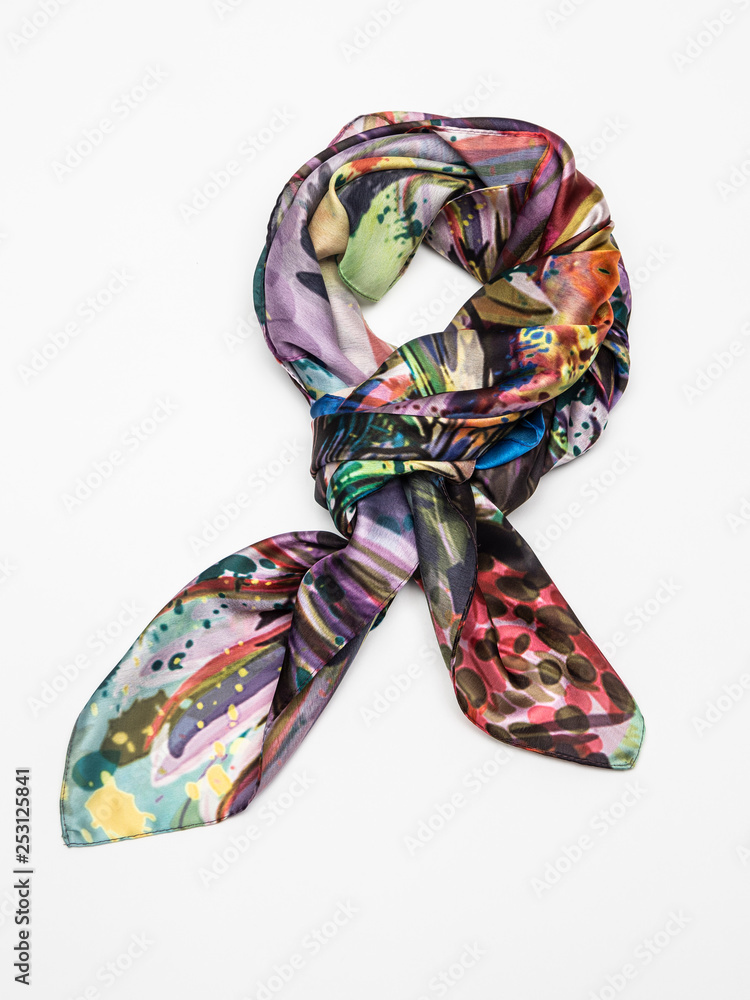 Multicolor silk scarf on white background. Top view.