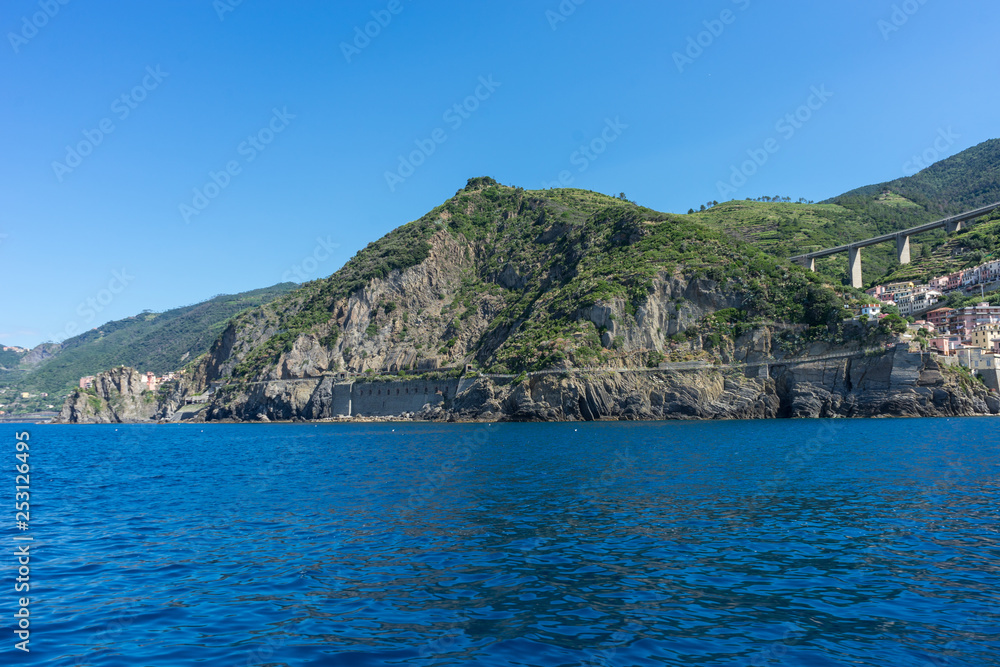 Obraz premium The cityscape of Riomaggiore viewed from the sea, Cinque Terre, Italy, Riviera