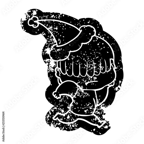 cartoon distressed icon of a boy with untidy hair wearing santa hat