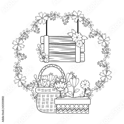 beautiful flowers in pot and basket with wooden label