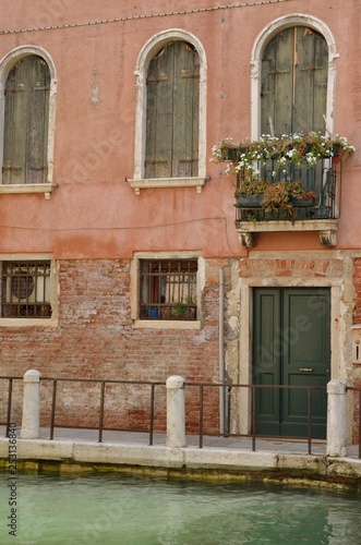 Traditional building in canal of Venice, Italy © monysasi