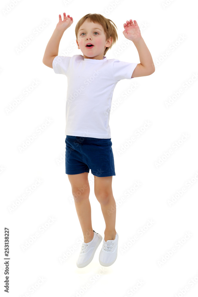 A little boy in a clean white T-shirt is jumping fun. A little boy in a clean white T-shirt is jumping fun.