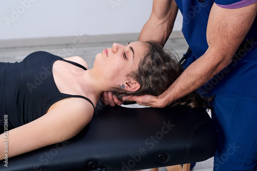 Chiropractic getting mobilization cervical spine of a woman. Manual therapy. Neurological physical examination. Osteopathy, physiotherapist