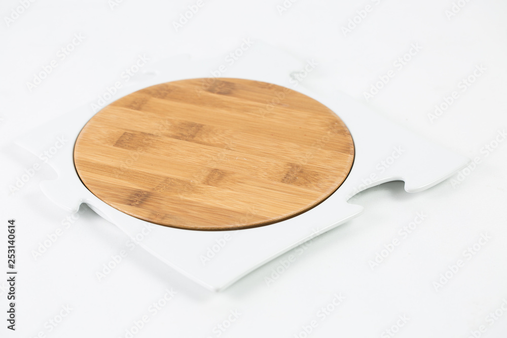 wooden spoon and fork on a plate isolated on white wooden spoon and fork on a plate isolated on white