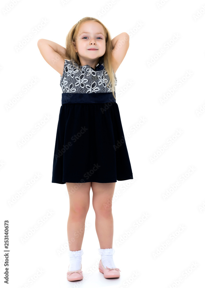 Fototapeta premium Little girl posing in studio on a white background.