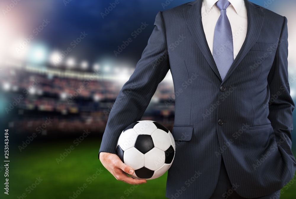 Close-up young male businessman holding Soccer ball Close-up young male businessman holding Soccer ball