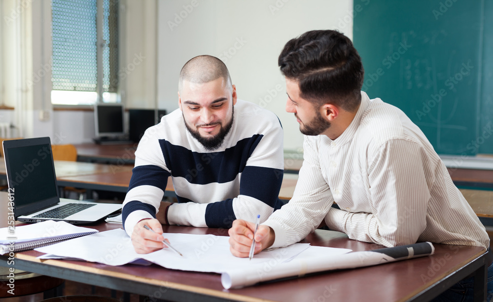 Students preparing for exams in classroom