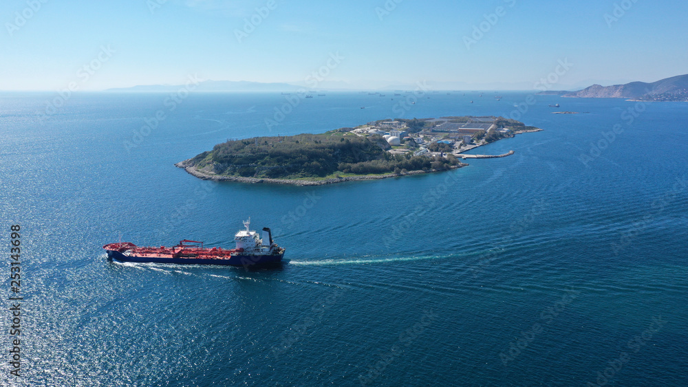 Aerial drone view photo of industrial tanker cruising in mediterranean sea