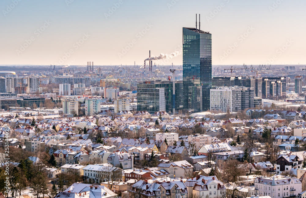 View of Gdansk, Oliwa district, town in Poland, old houses, commercial modern building.