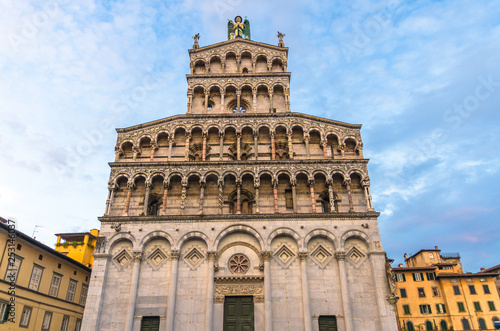 Facade of Chiesa di San Michele in Foro St Michael Roman Catholic church basilica on Piazza San Michele square in historical centre of old medieval town Lucca, evening view, Tuscany, Italy
