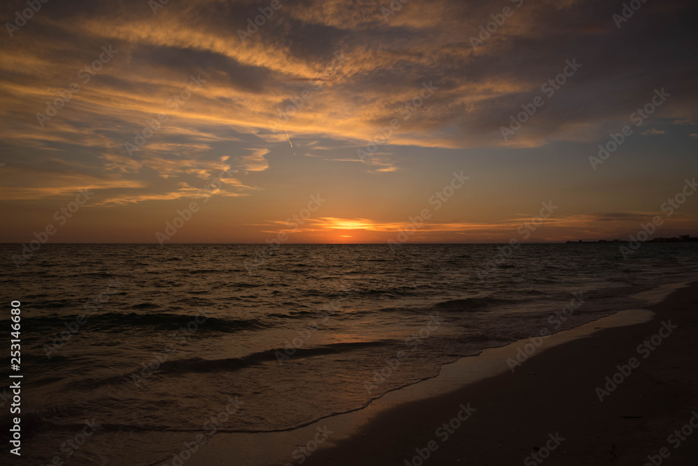 Orange flash in Florida at sunset on a Treasure Island Beach