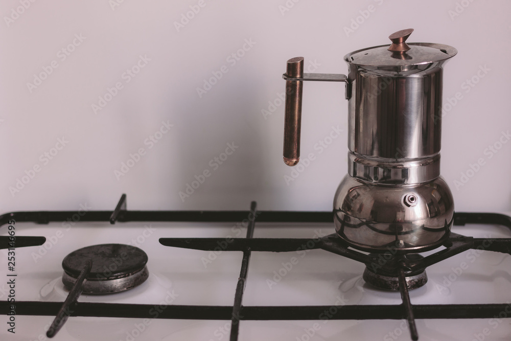 The concept of making coffee in a home kitchen. The geyser coffee
