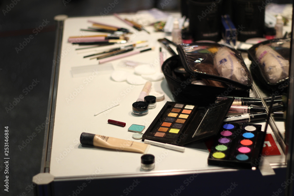 Various beauty products background. Makeup accessories on the table in a room. Cosmetic set. Beauty and fashion. Womens Various beauty products background. Makeup accessories on the table in a room. Cosmetic set. Beauty and fashion. Womens