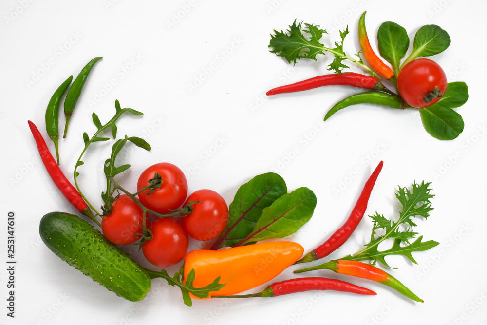 Fototapeta Healthy diet fresh vegetables flat lay isolated on white. Tomato, bell-pepper, cucumber, ruccola, mangold. Copy space text horizontal banner template