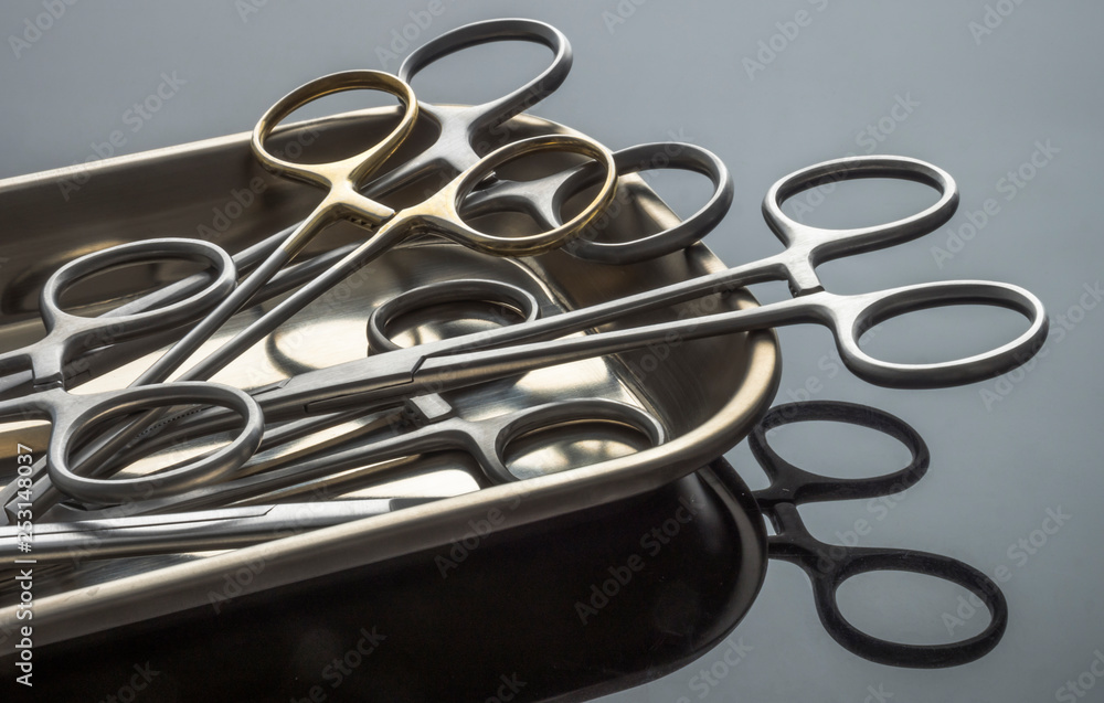 Some scissors for surgery on a tray, conceptual image, horizontal composition Some scissors for surgery on a tray, conceptual image, horizontal composition