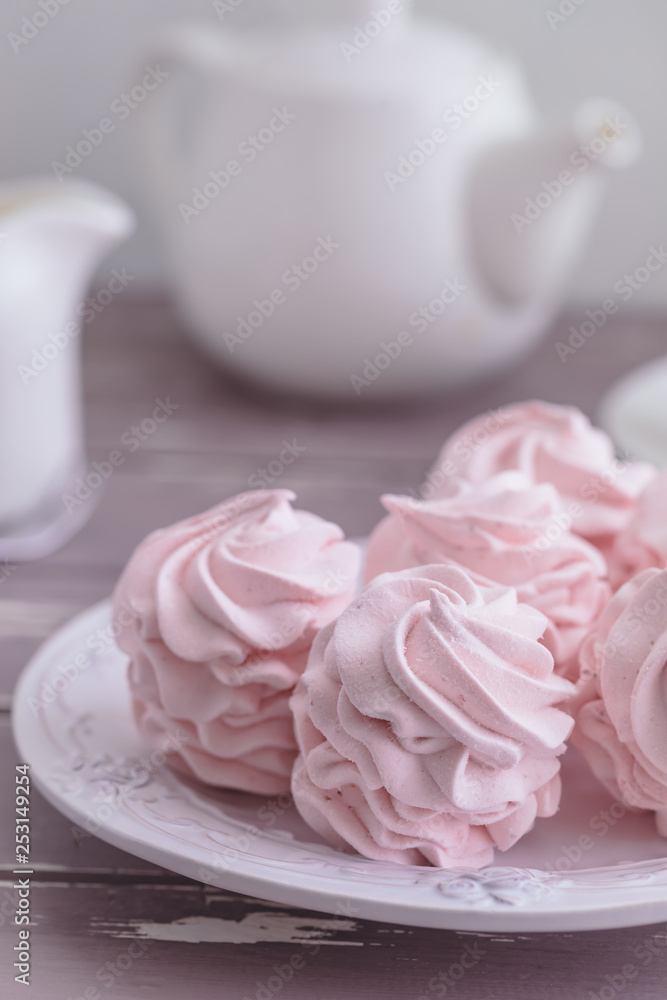 Traditional Russian homemade merengue marshmallow or zephyr on a plate on wooden background