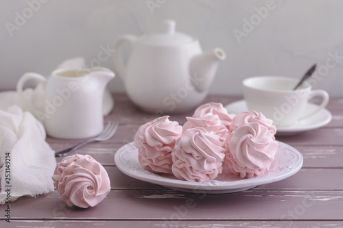 Traditional Russian homemade merengue marshmallow or zephyr on a plate on wooden background