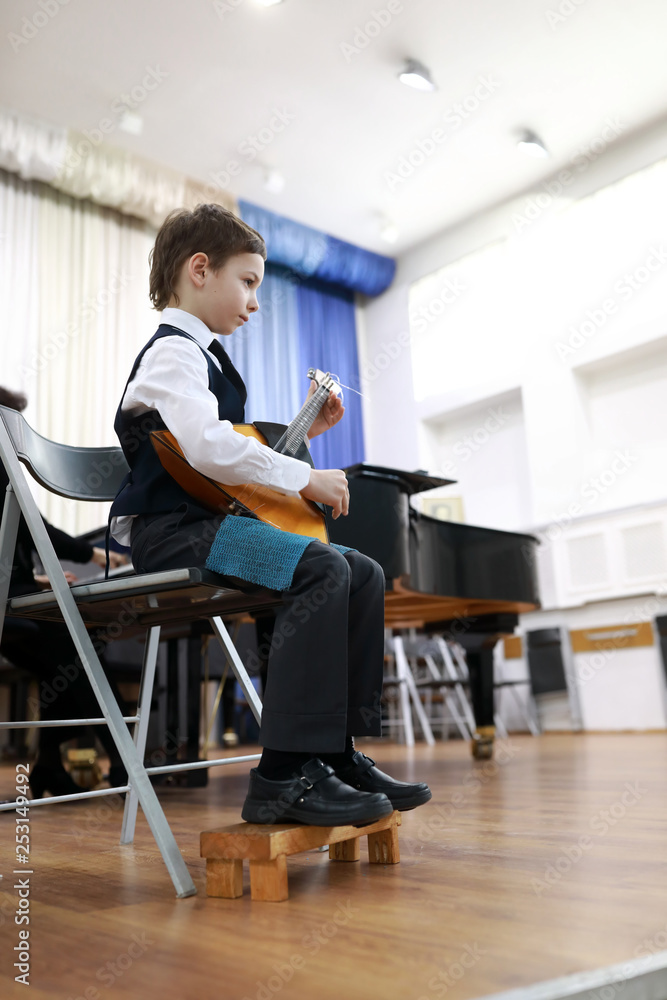 Boy plays the balalaika Boy plays the balalaika