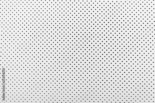 Modern luxury Car white leather interior.  Part of perforated leather car seat details. White Perforated leather texture background. Texture, artificial leather with stitching. Perforated leather seat