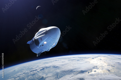 Fototapeta Naklejka Na Ścianę i Meble -  SpaceX Crew Dragon spacecraft in low-Earth orbit. Elements of this image furnished by NASA.